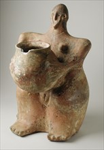 Female Figurine Holding Jar. Creator: Unknown.