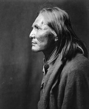 Alchise, Apache Indian, half-length portrait, left profile, c1906. Creator: Edward Sheriff Curtis.