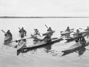 Eskimos in kayaks, Noatak, Alaska, c1929. Creator: Edward Sheriff Curtis.