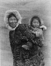 Woman and child, Nunivak, c1929. Creator: Edward Sheriff Curtis.
