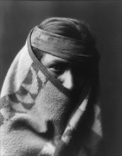 A Navaho [with blanket wrapped around head and shoulders], c1904. Creator: Edward Sheriff Curtis.