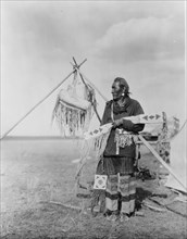 In a Blackfoot camp, c1927. Creator: Edward Sheriff Curtis.