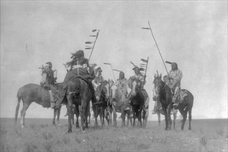 Atsina warriors, c1908. Creator: Edward Sheriff Curtis.