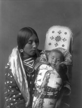 Mother and child-Apsaroke, c1908. Creator: Edward Sheriff Curtis.