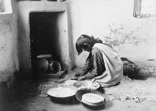 Zuni bread maker, c1903. Creator: Edward Sheriff Curtis.