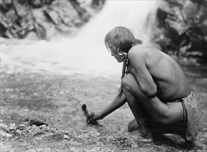 An offering at the waterfall-Nambe, 1927 Creator: Edward Sheriff Curtis.