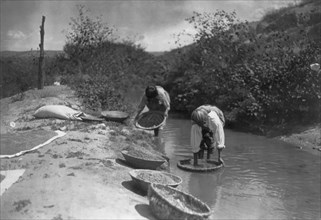 Washing wheat-San Juan, c1905. Creator: Edward Sheriff Curtis.