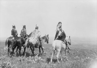 The chief and his staff, Apsaroke Indians, c1905. Creator: Edward Sheriff Curtis.