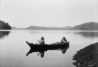 Canoeing on Clayquot Sound, c1910. Creator: Edward Sheriff Curtis.