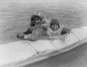 Boys in a kaiak (i.e., kayak)-Nunivak, c1929. Creator: Edward Sheriff Curtis.