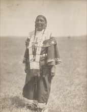 Spotted Eagle's wife, 1907. Creator: Edward Sheriff Curtis.
