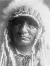 Red Hawk (Che-tan Luta)-Oglala, c1907. Creator: Edward Sheriff Curtis.