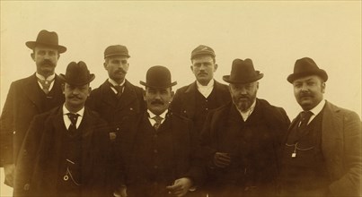 Seven men, half-length portrait, facing front,1894 or 1895. Creator: Alfred Lee Broadbent.
