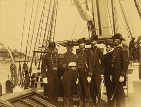 Six naval officers, full-length portrait, standing on deck of ship, 1894 or 1895. Creator: Alfred Lee Broadbent.