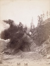 In mid air A wonderful blast in building railroad to Deadwood, 1890. Creator: John C. H. Grabill.