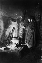 Girl at the hearth, late 19th cent - early 20th cent. Creator: I Popov.