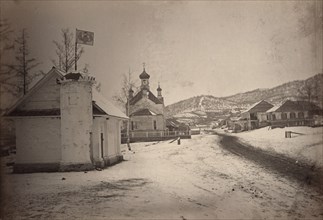 View of a settlement or village with a government(?) building and a church..., between 1885 and 86. Creator: Unknown.