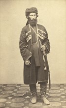Full-length portrait of Transcaucasian man, standing, facing front, between 1870 and 1886. Creator: Unknown.