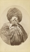 Half-length portrait of Aleksander Bek, facing front, between 1870 and 1886. Creator: Unknown.