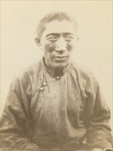 Half-length portrait of man, seated, facing front, between 1870 and 1886. Creator: Unknown.