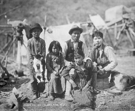 Cordova natives and dogs, between c1906 and 1915. Creator: Eric A. Hegg.