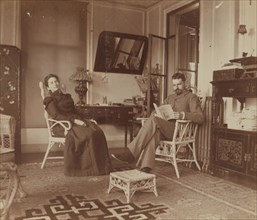 Eleanor and Frederick Pray, seated in the veranda room, Dom Smith, Vladivostok, Russia, 1900. Creator: Maud Morphew.