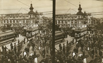 Crowds on a Tokyo street, near the train station(?), during the celebration of Admiral..., c1905. Creator: Underwood & Underwood.