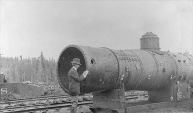 Frank G. Carpenter inspecting new railroad, between c1900 and 1916. Creator: Unknown.