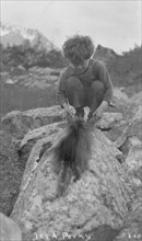 Child and porcupine, between c1900 and c1930. Creator: Unknown.