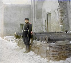 Sentry at the palace, and old cannons, Bukhara, between 1905 and 1915. Creator: Sergey Mikhaylovich Prokudin-Gorsky.