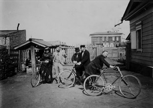 Cyclists in the courtyard of the estate, 1900. Creators: V. I. Podgorbunskii, I. A. Podgorbunskii.