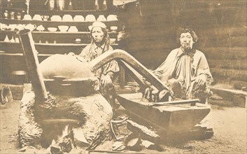 In a Kachin yurt. While preparing "araga" (wine), 1904-1917. Creator: Unknown.