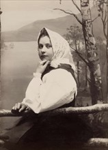 Photograph of a young girl in a white blouse and white headscarf, 1880-1890. Creator: Helene Edlund.