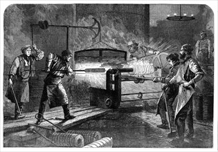 Manufacture of the Armstrong Gun at Woolwich Arsenal: coiling the bars, 1862. Creator: Unknown.