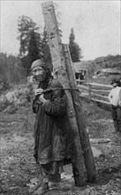 Old Shoria Woman Collecting Wood; The Kumys Ulus, 1913. Creator: GI Ivanov.