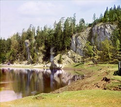 Vysokiy Rock below the village of Treki, Chusovaya River, 1912. Creator: Sergey Mikhaylovich Prokudin-Gorsky.