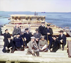 Group of railroad construction participants on the pier in Kem-Pristan, 1915. Creator: Sergey Mikhaylovich Prokudin-Gorsky.