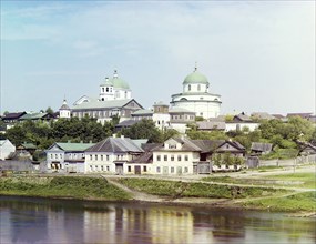 Torzhok, embankment of the river Tvertsa. In the distance, the Resurrection Monastery, 1910. Creator: Sergey Mikhaylovich Prokudin-Gorsky.