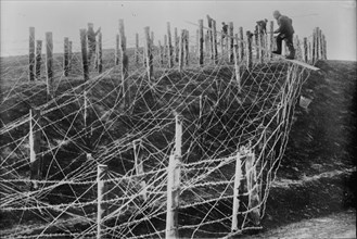 Germans fixing barbed wire tangle, between c1914 and c1915. Creator: Bain News Service.