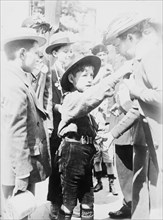 Boy Scout, Paris, Selling "Journee Francaise" Medals, between 1914 and c1915. Creator: Bain News Service.