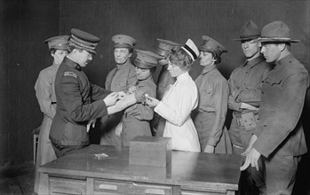 Major Connell inoculating woman motorist, 29 May 1917. Creator: Bain News Service.