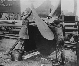 Women working on propeller, Eng. [i.e. England], between c1915 and 1917. Creator: Bain News Service.