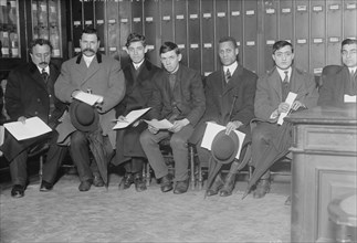Candidates for naturalization seated with papers, 1910. Creator: Bain News Service.