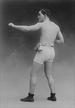 Tommy Murphy in athletic trunks, 1910. Creator: Bain News Service.