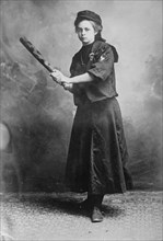 Miss Myrtle Rowe holding a baseball bat, 1910. Creator: Bain News Service.