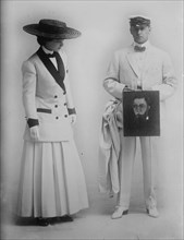 Paula Marr and Wm. Collier holding picture, 1910. Creator: Bain News Service.
