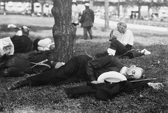 Asleep in Battery Park on hot day, between c1910 and c1915. Creator: Bain News Service.
