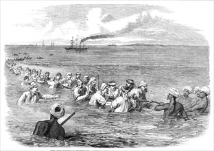 The Indo-European Telegraph: Landing The Cable in the mud at Fao, Persian Gulf, 1865. Creator: Unknown.