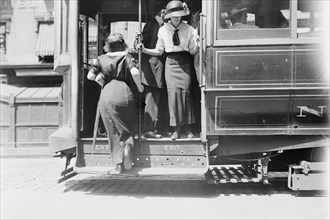 Getting on Brdway car, between c1910 and c1915. Creator: Bain News Service.