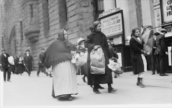 Carrying home Xmas baskets, between c1910 and c1915. Creator: Bain News Service.
